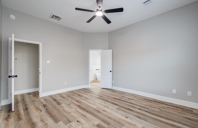 4506 Knights Ct, Baytown, TX 77521 - unfurnished bedroom featuring light wood-type flooring, baseboards, ensuite bath, and ceiling fan
