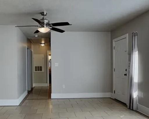 5939 Belcrest St, Houston, TX 77033 - unfurnished room featuring ceiling fan, attic access, and baseboards