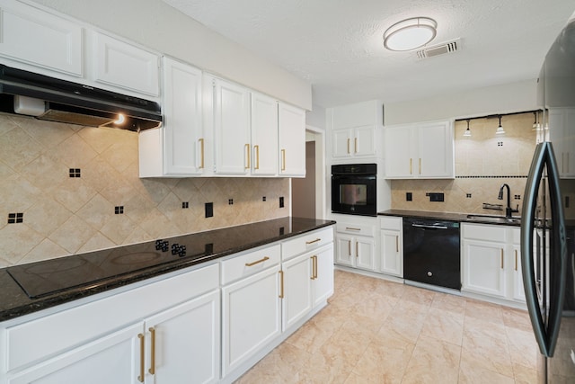 801 Thornwood Dr, Shenandoah, TX 77381 - kitchen featuring black appliances, under cabinet range hood, backsplash, white cabinetry, and a textured ceiling