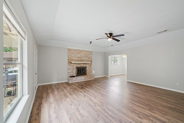 801 Thornwood Dr, Shenandoah, TX 77381 - unfurnished living room featuring a ceiling fan, wood finished floors, and baseboards