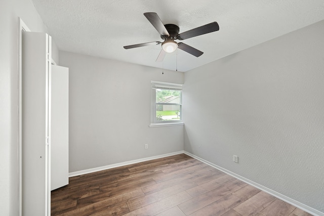 801 Thornwood Dr, Shenandoah, TX 77381 - spare room featuring wood finished floors, baseboards, and ceiling fan