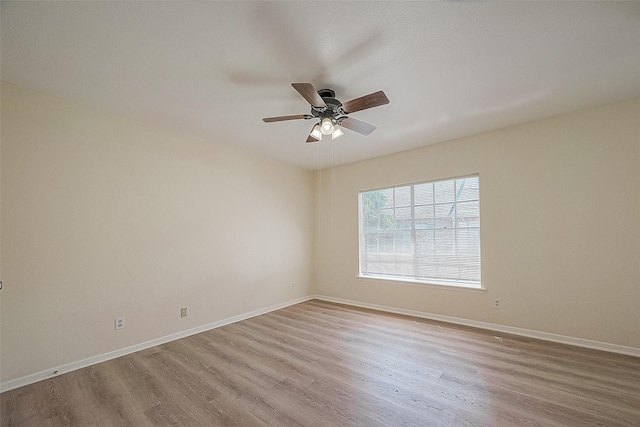3968 Belle Park Dr, Houston, TX 77072 - spare room with wood finished floors, ceiling fan, and baseboards