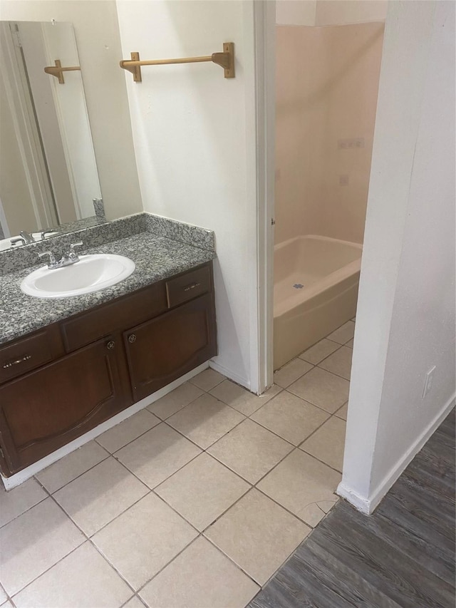 22307 Fincastle Dr, Katy, TX 77450 - bathroom featuring tile patterned flooring, vanity, a shower, and baseboards