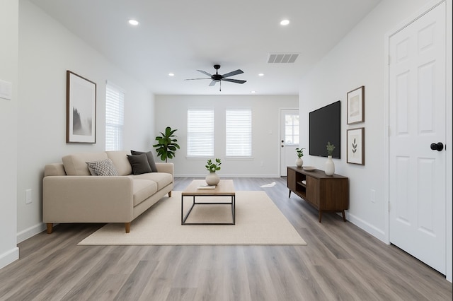318 New Hampshire St, Houston, TX 77029 - living room with a ceiling fan, light wood-type flooring, baseboards, and recessed lighting