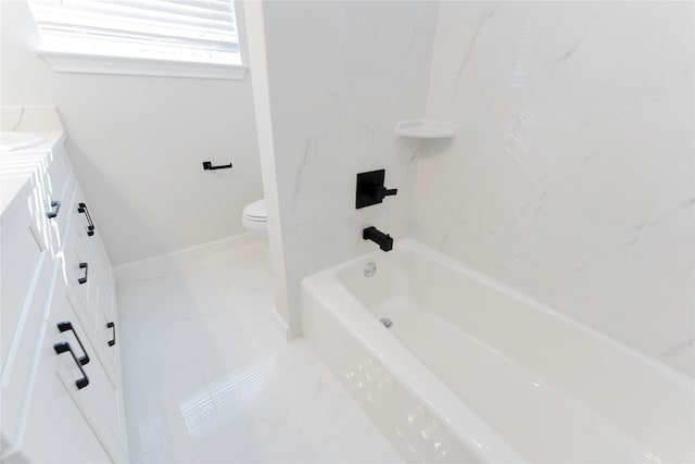 318 New Hampshire St, Houston, TX 77029 - bathroom featuring marble look tiles, vanity, toilet, bathtub / shower combination, and baseboards