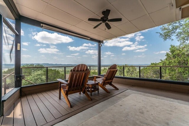 1328 Lakepark Dr, Lakehills, TX 78063 - sunroom / solarium featuring ceiling fan, healthy amount of natural light, and concrete flooring