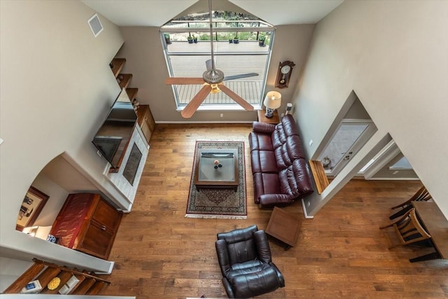 1328 Lakepark Dr, Lakehills, TX 78063 - living room with wood finished floors, ceiling fan, vaulted ceiling, and baseboards