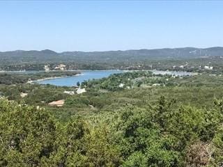 1328 Lakepark Dr, Lakehills, TX 78063 - view of mountain backdrop with a nearby body of water and a heavily wooded area