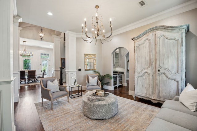 5659 Willers Way, Houston, TX 77056 - living room with a chandelier, arched walkways, wood finished floors, crown molding, and recessed lighting
