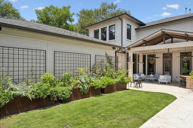 5659 Willers Way, Houston, TX 77056 - view of green lawn featuring a patio, an outdoor hangout area, and a ceiling fan