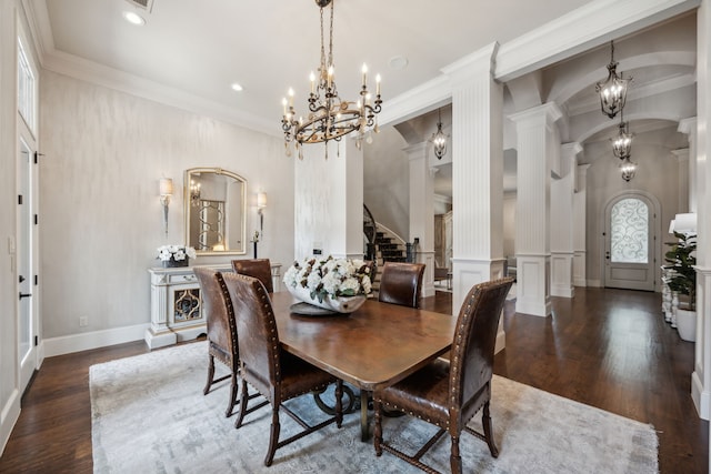 5659 Willers Way, Houston, TX 77056 - dining area with a chandelier, ornamental molding, wood finished floors, stairway, and ornate columns