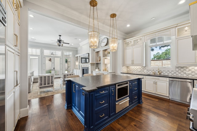 5659 Willers Way, Houston, TX 77056 - kitchen with blue cabinetry, dishwasher, ceiling fan, a sink, and dark countertops