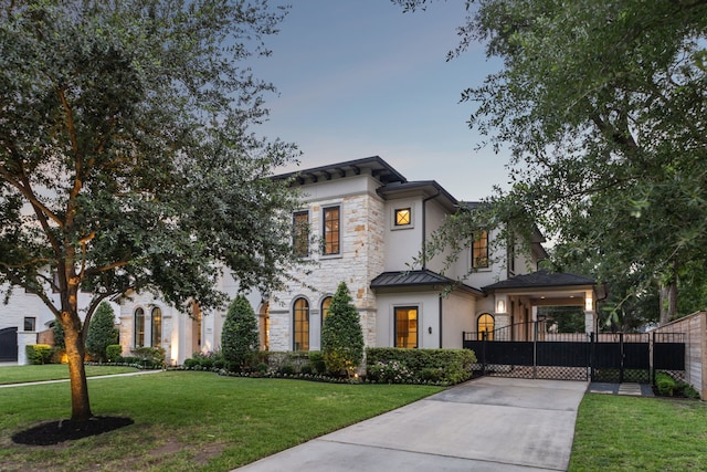 5659 Willers Way, Houston, TX 77056 - view of front of home with stone siding, stucco siding, a gate, and a standing seam roof