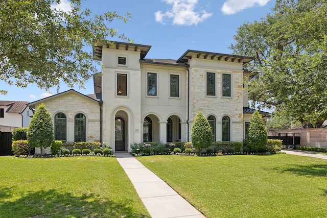 5659 Willers Way, Houston, TX 77056 - view of front facade with stone siding, a front yard, and stucco siding