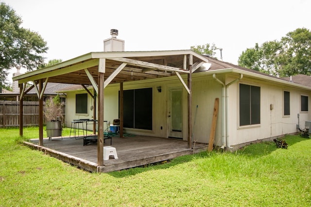3906 Cyril Dr, Humble, TX 77396 - rear view of property with a deck and a chimney