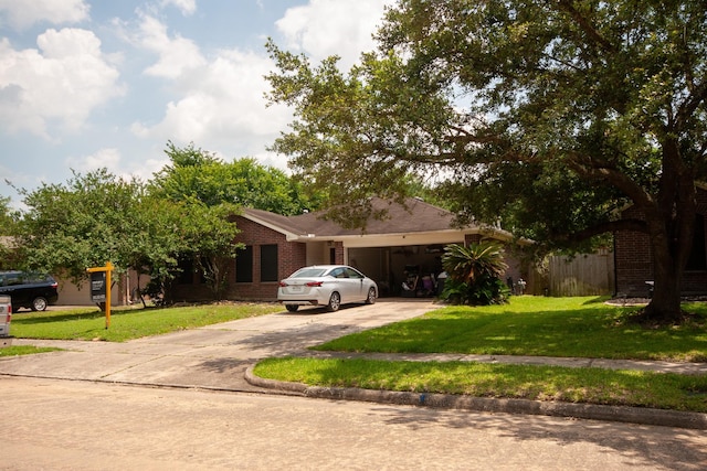 3906 Cyril Dr, Humble, TX 77396 - view of front of property featuring driveway, brick siding, a front yard, and a garage