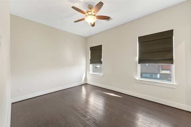 824 W 20th St, Houston, TX 77008 - unfurnished room featuring ceiling fan, plenty of natural light, baseboards, and dark wood-style flooring