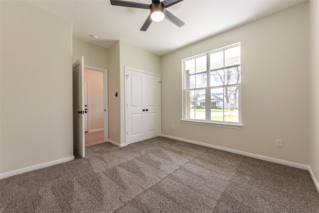 217 E Southland Ave, Alvin, TX 77511 - unfurnished bedroom with carpet, baseboards, a ceiling fan, and a closet