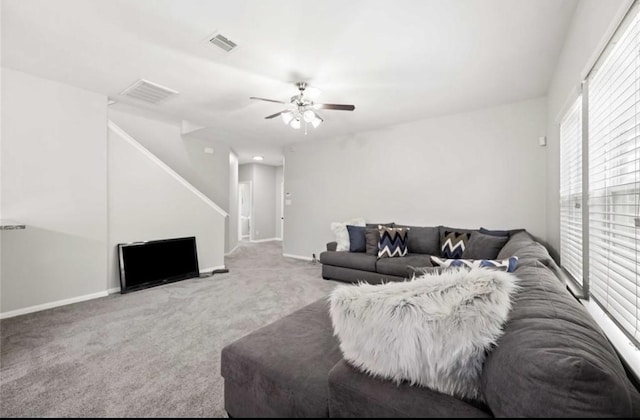 17439 Hayley Springs Ct, Humble, TX 77396 - living area featuring carpet floors, ceiling fan, stairway, and baseboards