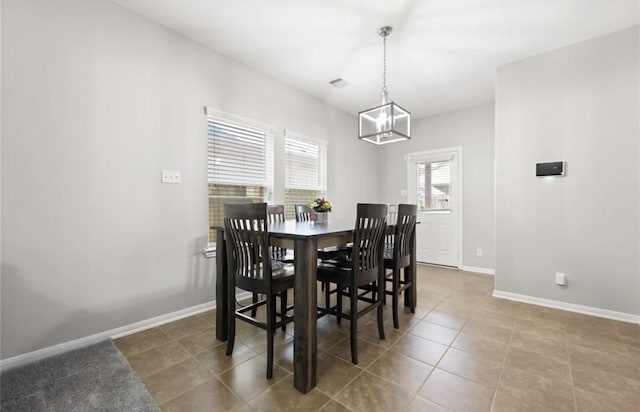 17439 Hayley Springs Ct, Humble, TX 77396 - tiled dining area featuring a chandelier and baseboards