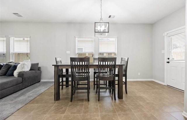 17439 Hayley Springs Ct, Humble, TX 77396 - dining room featuring a chandelier, light tile patterned flooring, and baseboards