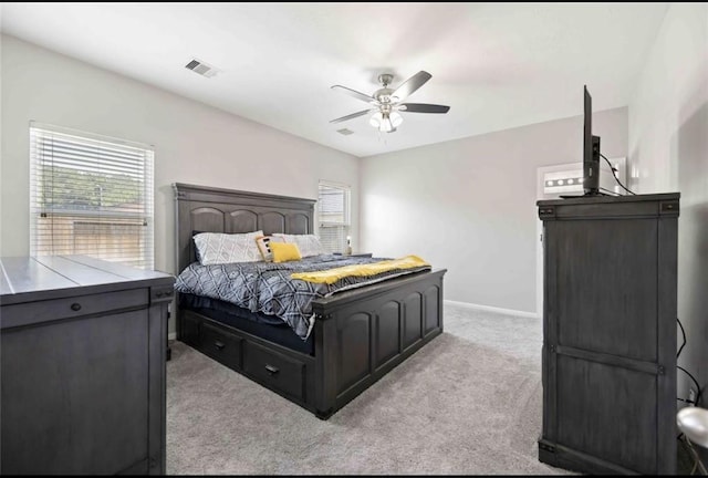 17439 Hayley Springs Ct, Humble, TX 77396 - bedroom with light colored carpet, ceiling fan, and baseboards