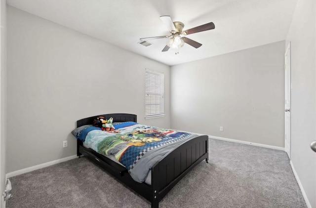 17439 Hayley Springs Ct, Humble, TX 77396 - carpeted bedroom with baseboards and a ceiling fan