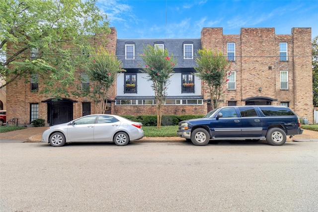 1909 Brun St Unit 17, Houston, TX 77019 - multi unit property featuring mansard roof and brick siding