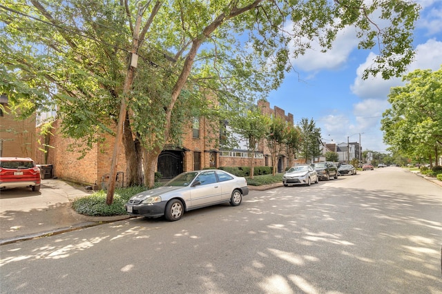 1909 Brun St Unit 17, Houston, TX 77019 - view of asphalt road with curbs, a residential view, and sidewalks