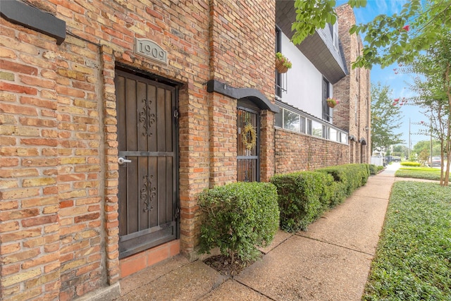 1909 Brun St Unit 17, Houston, TX 77019 - doorway to property featuring brick siding