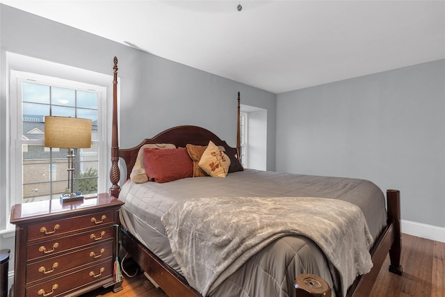 1909 Brun St Unit 17, Houston, TX 77019 - bedroom featuring wood finished floors and baseboards