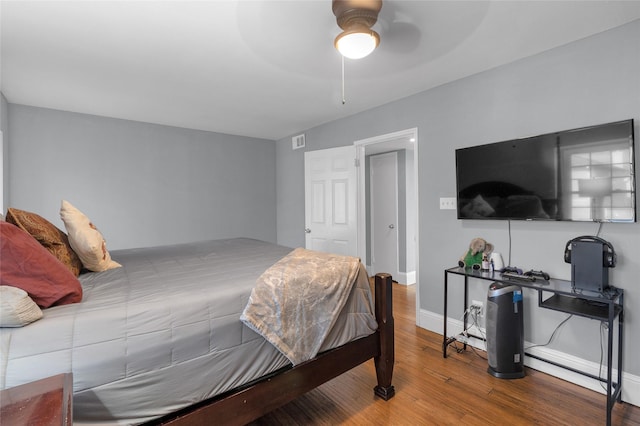 1909 Brun St Unit 17, Houston, TX 77019 - bedroom featuring wood finished floors, baseboards, and ceiling fan
