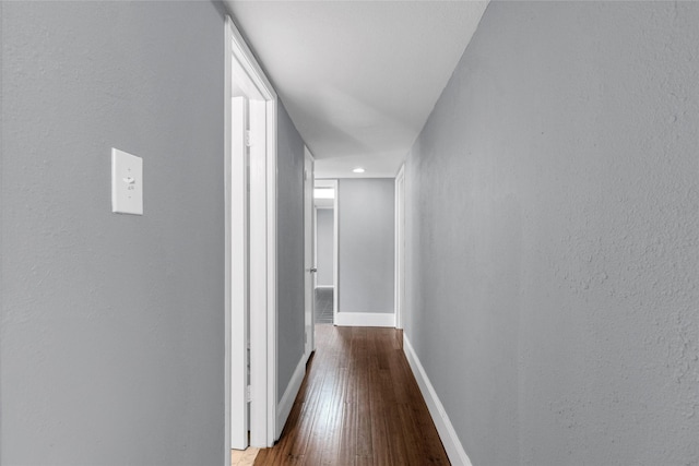 1909 Brun St Unit 17, Houston, TX 77019 - hall featuring wood-type flooring, baseboards, and a textured wall