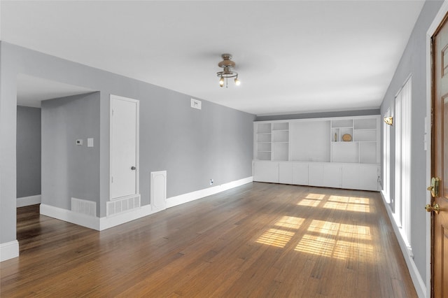 1909 Brun St Unit 17, Houston, TX 77019 - spare room featuring hardwood / wood-style flooring and baseboards