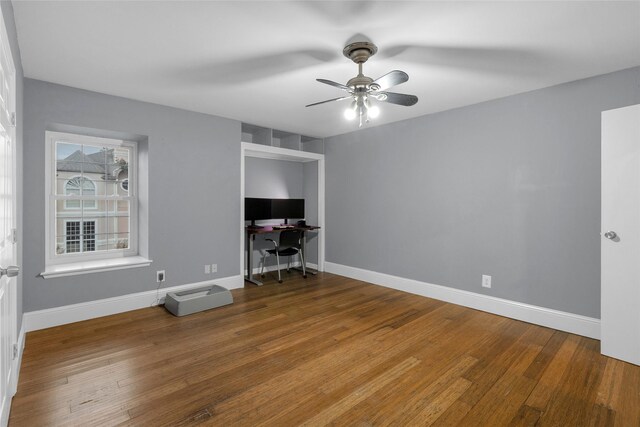 1909 Brun St Unit 17, Houston, TX 77019 - unfurnished office featuring ceiling fan, wood finished floors, and baseboards