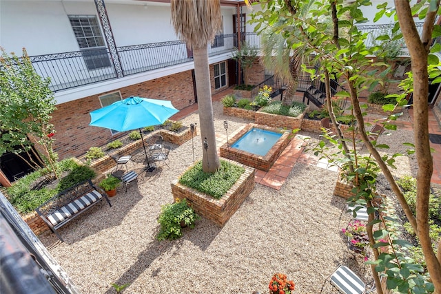 1909 Brun St Unit 17, Houston, TX 77019 - view of swimming pool with a patio area and an in-ground hot tub