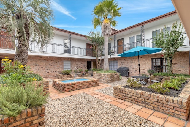 1909 Brun St Unit 17, Houston, TX 77019 - surrounding community with a hot tub and a patio