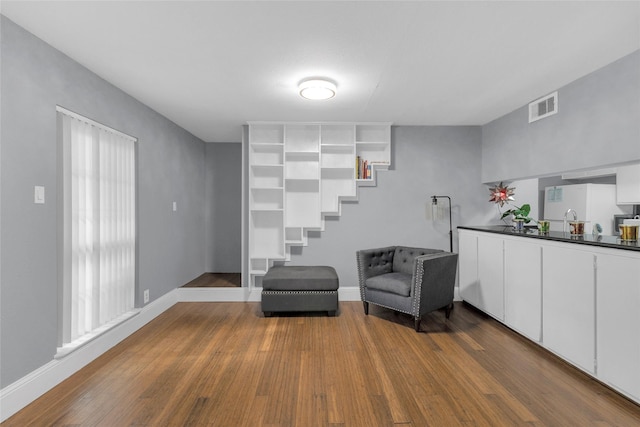 1909 Brun St Unit 17, Houston, TX 77019 - living area featuring dark wood-type flooring and baseboards