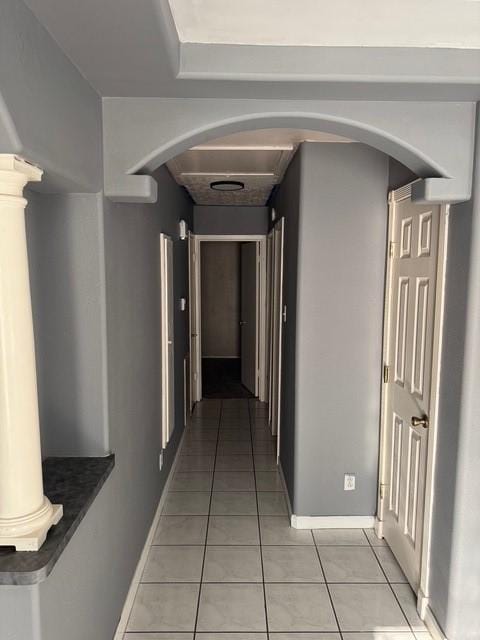 13023 High Star Dr, Houston, TX 77072 - hall with light tile patterned floors, arched walkways, and baseboards