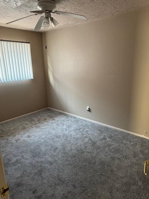 13023 High Star Dr, Houston, TX 77072 - carpeted spare room with a ceiling fan, baseboards, and a textured ceiling