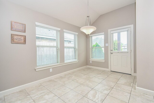 19527 Sundance Edge Ct, Richmond, TX 77407 - unfurnished dining area featuring plenty of natural light, light tile patterned flooring, vaulted ceiling, and baseboards