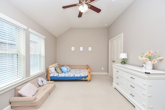 19527 Sundance Edge Ct, Richmond, TX 77407 - bedroom with light carpet, lofted ceiling, baseboards, and a ceiling fan
