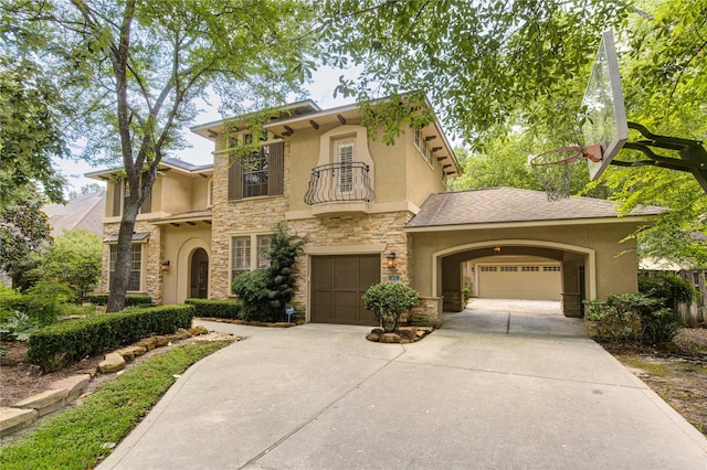 62 W Mirror Ridge Cir, The Woodlands, TX 77382 - view of front of house featuring a balcony, stucco siding, stone siding, and concrete driveway