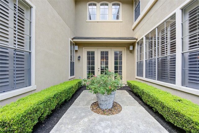 62 W Mirror Ridge Cir, The Woodlands, TX 77382 - view of exterior entry featuring stucco siding