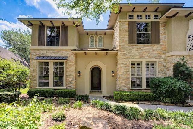 62 W Mirror Ridge Cir, The Woodlands, TX 77382 - view of front facade with stucco siding and stone siding