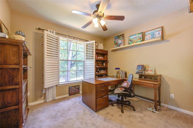 62 W Mirror Ridge Cir, The Woodlands, TX 77382 - home office featuring ceiling fan, light colored carpet, baseboards, and a textured ceiling