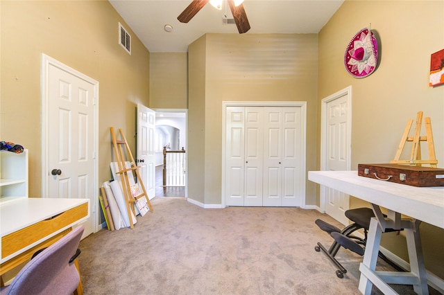 62 W Mirror Ridge Cir, The Woodlands, TX 77382 - carpeted office space featuring a towering ceiling, a ceiling fan, and baseboards