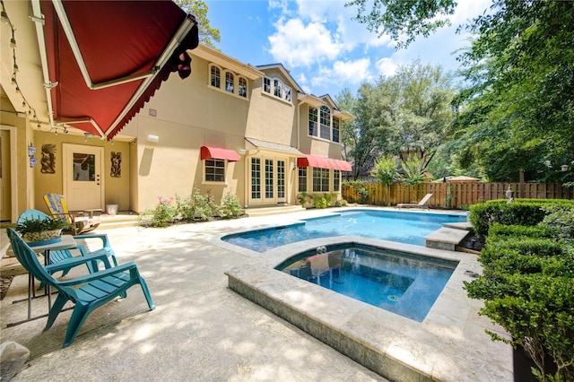 62 W Mirror Ridge Cir, The Woodlands, TX 77382 - view of pool with french doors, a patio, and an in-ground hot tub