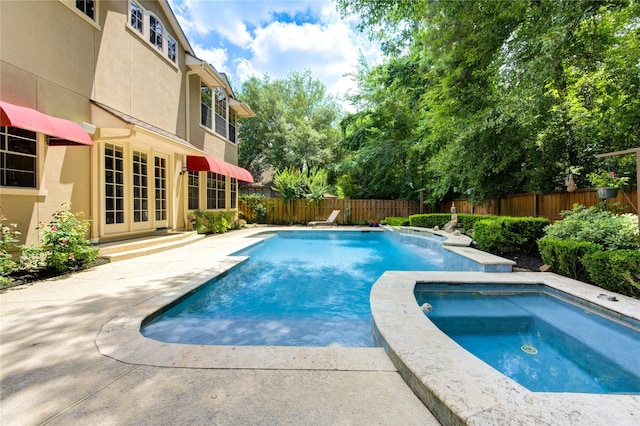 62 W Mirror Ridge Cir, The Woodlands, TX 77382 - view of swimming pool with french doors, a patio area, and a fenced backyard