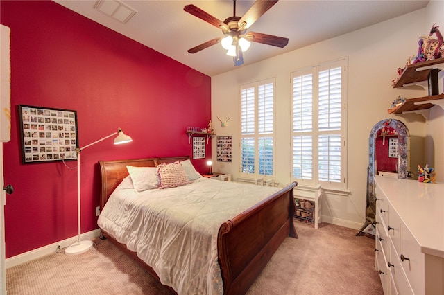 62 W Mirror Ridge Cir, The Woodlands, TX 77382 - bedroom with light carpet, baseboards, and ceiling fan